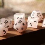 polyhedral dice on wooden surface